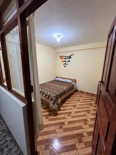 Postel nebo postele na pokoji v ubytování Hospedaje Catalina
