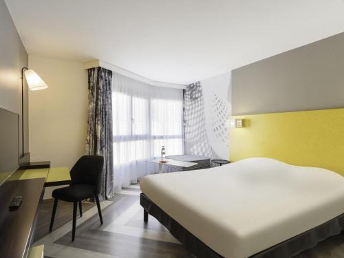 Postel nebo postele na pokoji v ubytování Ibis Styles Nice Centre Port