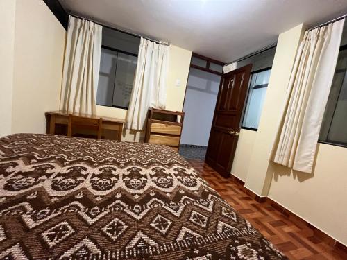 Postel nebo postele na pokoji v ubytování Hospedaje Catalina