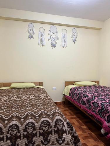 Postel nebo postele na pokoji v ubytování Hospedaje Catalina