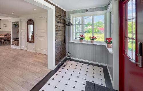 a hallway of a home with a red door at Pet Friendly Home In Bolmsö With Sauna in Bolmsö