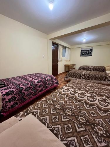 Postel nebo postele na pokoji v ubytování Hospedaje Catalina
