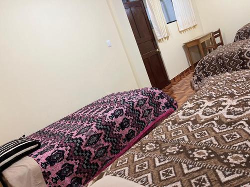 Postel nebo postele na pokoji v ubytování Hospedaje Catalina