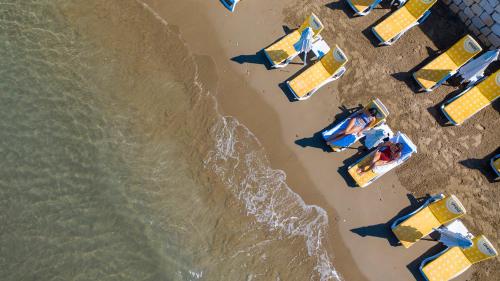 an overhead view of a beach with people and umbrellas at Side Beach Club in Side