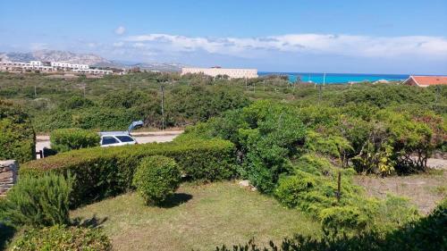 a view of the ocean from a house at Case Verdemare Stintino in Stintino