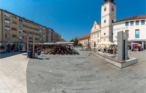 a town square with a clock tower and a building at Stunning Home In Strigova With Wifi in Štrigova