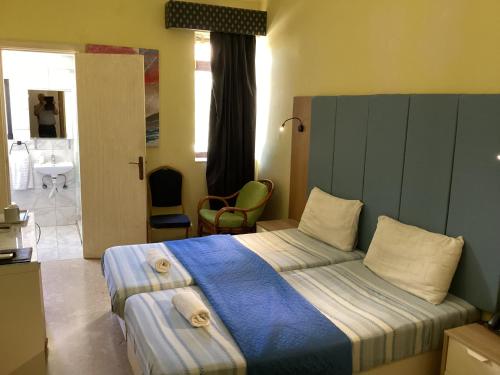 Postel nebo postele na pokoji v ubytování Whitestar Guesthouse