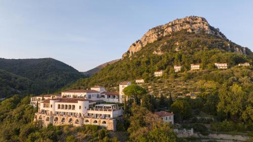 a house on a hill with a mountain at Château Saint-Martin & Spa, Oetker Hotels in Vence