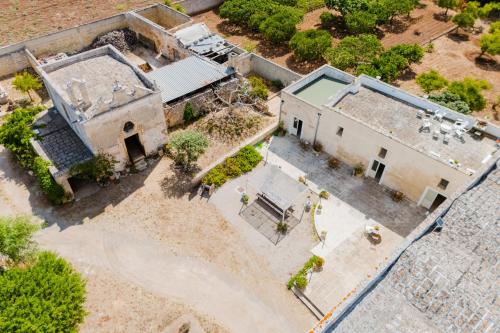 an overhead view of an old building with a pool at Masseria La Lizza - Ospitalità Rurale in Lecce
