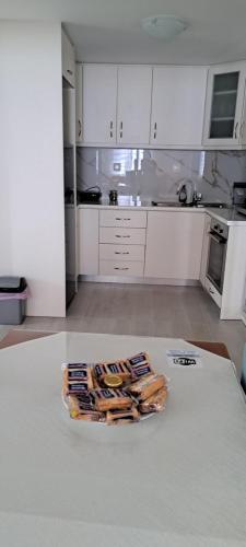 a white kitchen with a tray of food on a table at Ανεμώνη Αράχωβα in Arachova