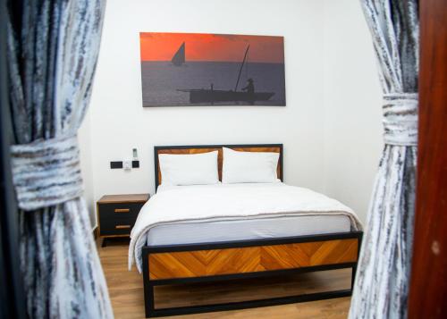 Postel nebo postele na pokoji v ubytování Mwambani Beach Villas (Tanga)