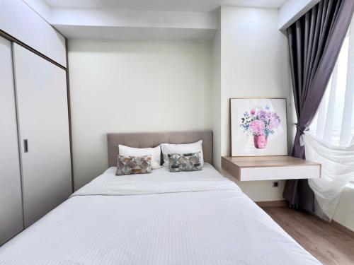 Ένα ή περισσότερα κρεβάτια σε δωμάτιο στο 2BR The Peak Midtown M8