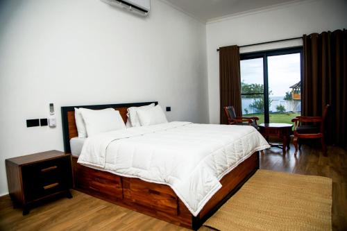 Postel nebo postele na pokoji v ubytování Mwambani Beach Villas (Tanga)
