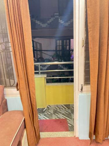 an open door with a view of a balcony at Mountain view Escape in Kathmandu