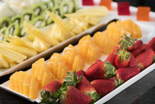 a display of fruit and vegetables with strawberries and crackers at NH Collection Salamanca Palacio de Castellanos in Salamanca