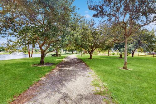 a dirt path in a park with trees at Sebastian Serenity in Sebastian