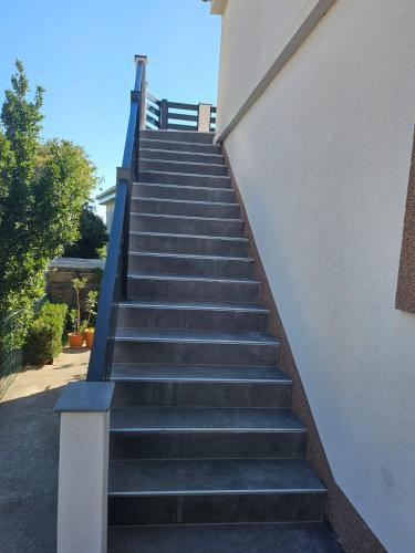 a set of stairs leading up to a building at Ana & Stela in Karlobag