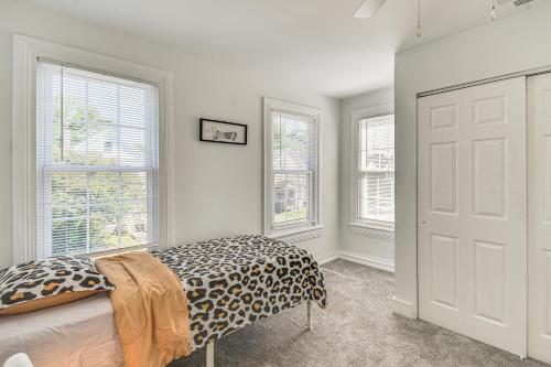 a bedroom with a bed with a animal print blanket at Spacious Family Home with Yard in Dtwn Hampton! in Hampton