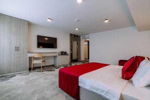 Postel nebo postele na pokoji v ubytování ARIS Boutique Hotel & SPA