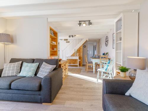 a living room with a couch and a table at Bon Accorde in Goodwick