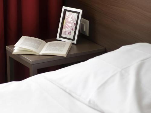 Postel nebo postele na pokoji v ubytování Aparthotel Adagio Basel City