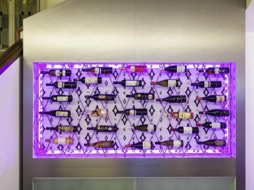 a purple display case filled with different types of fish at Mercure Ostrava Center in Ostrava