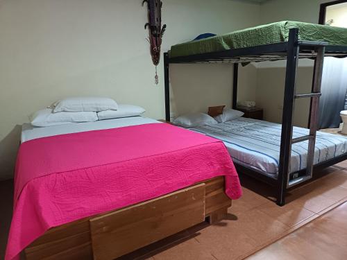 Postel nebo postele na pokoji v ubytování Villa Granja Agua Azul-wi-fi-AC-6 Personas-parqueo