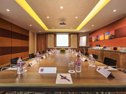 a conference room with a long table with bottles of water at ibis Chennai Sipcot - An Accor Brand in Chennai