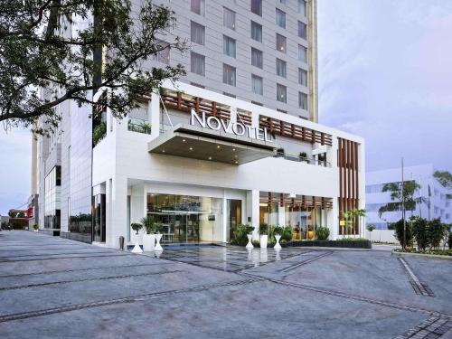 a novation sign on the front of a building at Novotel Chennai Sipcot in Chennai