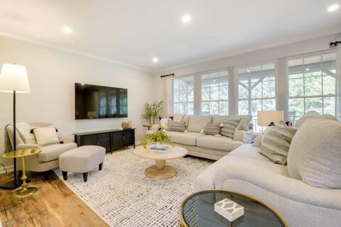 a living room with a couch and a table at Serene 3 bedroom home in Apex in Apex