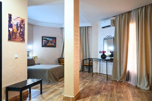 two pictures of a hotel room with a bed and a table at Hotel Nouzha in Fès