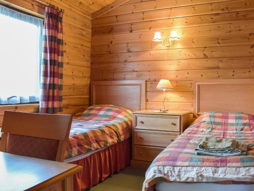 Ένα ή περισσότερα κρεβάτια σε δωμάτιο στο Jasmine Lodge