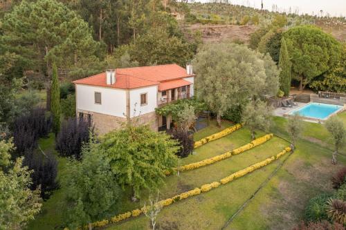 an aerial view of a house with a swimming pool at Portugal Active São Julião Retreat | Pool, Jacuzzi & Garden Escape in Mato