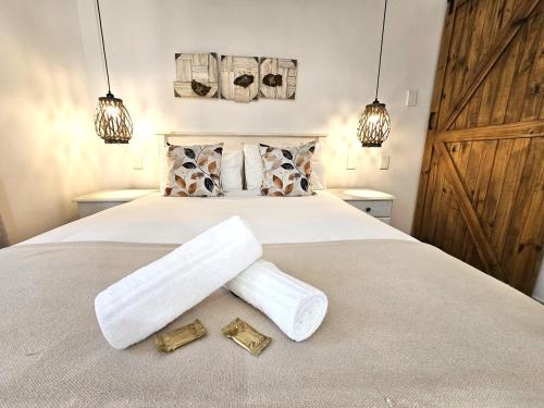 Ένα ή περισσότερα κρεβάτια σε δωμάτιο στο Leopard Tree Lodge