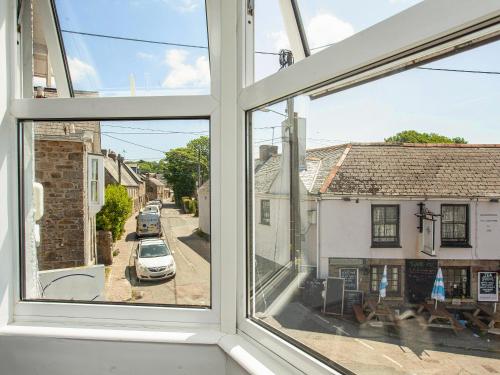 an open window with a view of a street at Upper Deck in Saint Erth