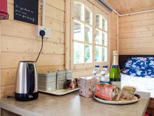 a counter with a coffee maker and a plate of food at Moonlight View - Uk35187 in Newtown