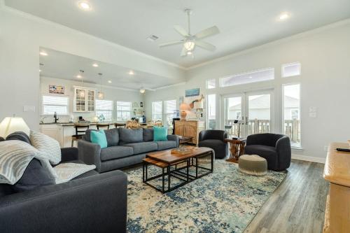 a living room with a couch and a table at Purple Paradise Beachy Fun Bay Beach Views in Hercules Offshore Heliport