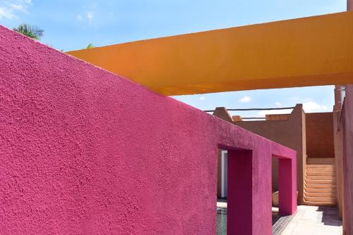 a building with a pink wall at Dar Syada Boutique Hotel Marrakech in Marrakech