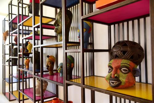 a bunch of bird cages with a mask in them at Dar Syada Boutique Hotel Marrakech in Marrakech
