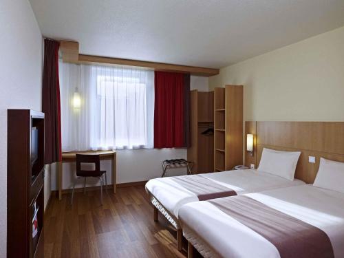 Katil atau katil-katil dalam bilik di Ibis Kraków Stare Miasto