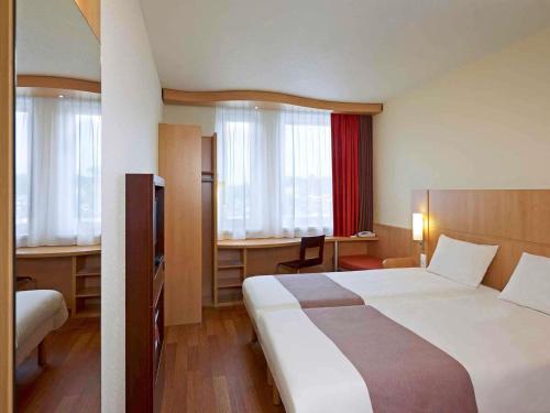 Katil atau katil-katil dalam bilik di Ibis Kraków Stare Miasto