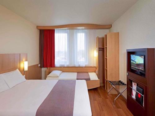 Katil atau katil-katil dalam bilik di Ibis Kraków Stare Miasto
