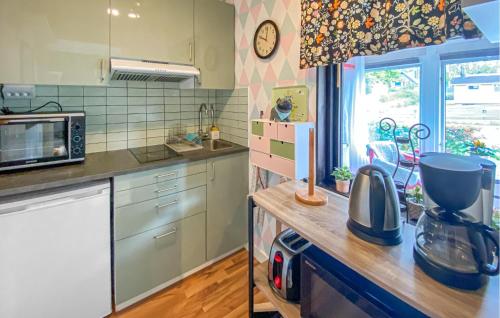 a kitchen with a counter top with a microwave at Lovely Apartment In Borgholm With Wifi in Borgholm
