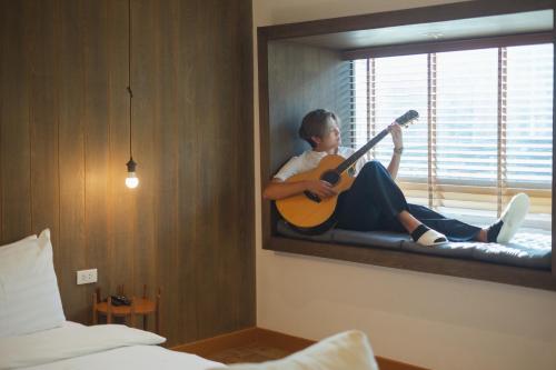 Katil atau katil-katil dalam bilik di The Folkster House Chiangkhan