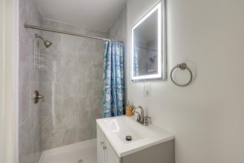 a bathroom with a sink and a shower at 17 Mi to Birmingham Renovated Home with Deck in Bessemer