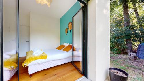 Ένα ή περισσότερα κρεβάτια σε δωμάτιο στο expat renting - Le Lumineux - Villa Design - Wi-Fi