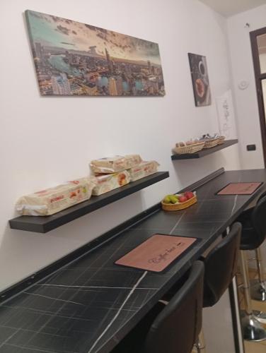 a kitchen with a counter with some food on it at Casa vacanze dell' Abbaddu 3 in Sassari