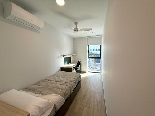 Ένα ή περισσότερα κρεβάτια σε δωμάτιο στο Residencia JC1