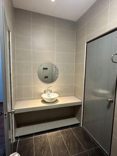 a bathroom with a sink and a mirror at 5-15pax Ampang Homestay 5BR House Near KLCC in Ampang