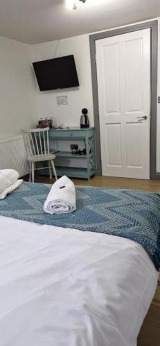 Cama o camas de una habitación en LilyRose Hotel
